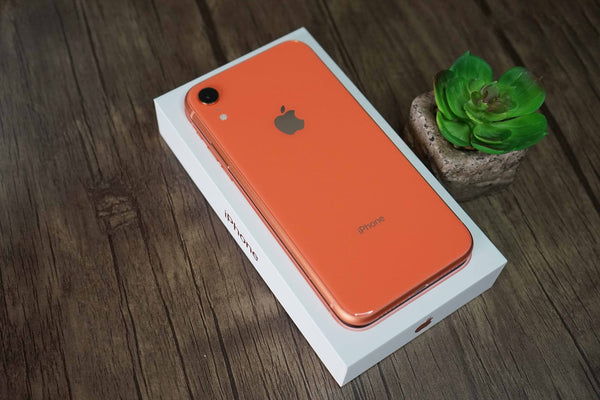 Orange iPhone on a wooden table