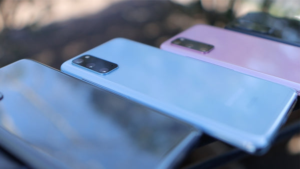 An out of focus image of three smartphones