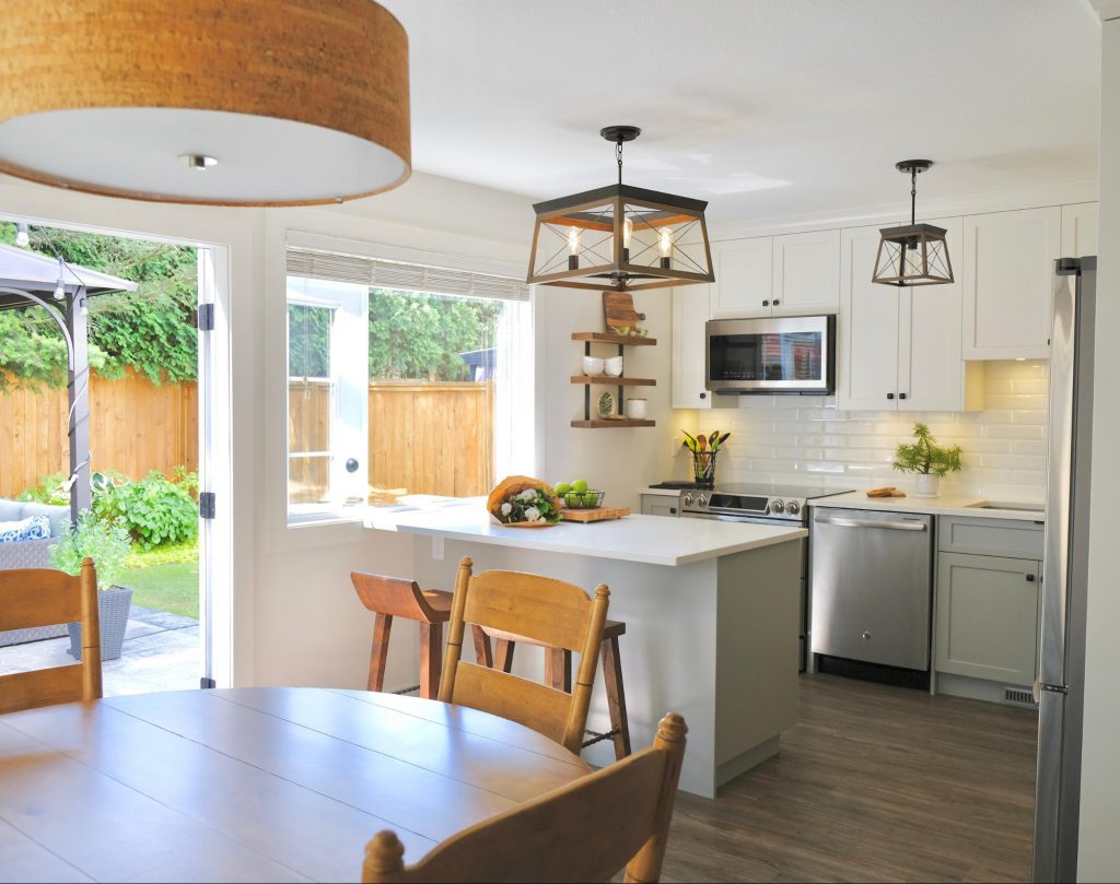 healthy kitchen with wooden furniture, plants and natural lighting