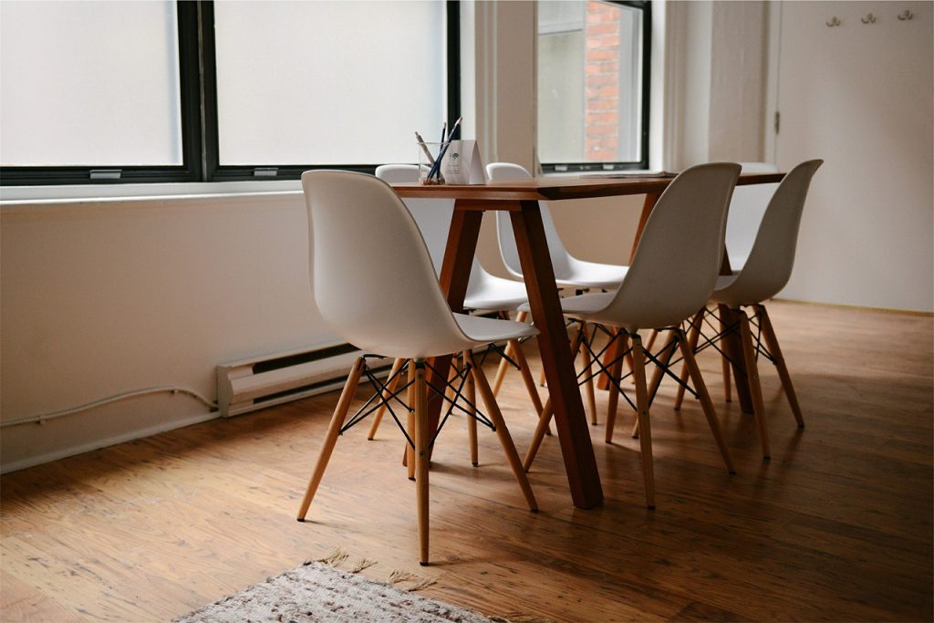 dining room table and chairs in a new apartment