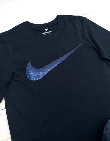 black nike with blue swoosh