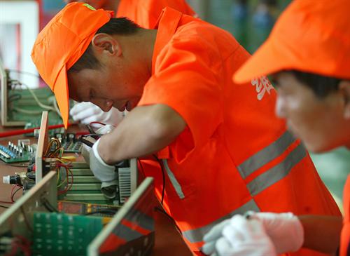 Chinese Employee in Orange Uniform