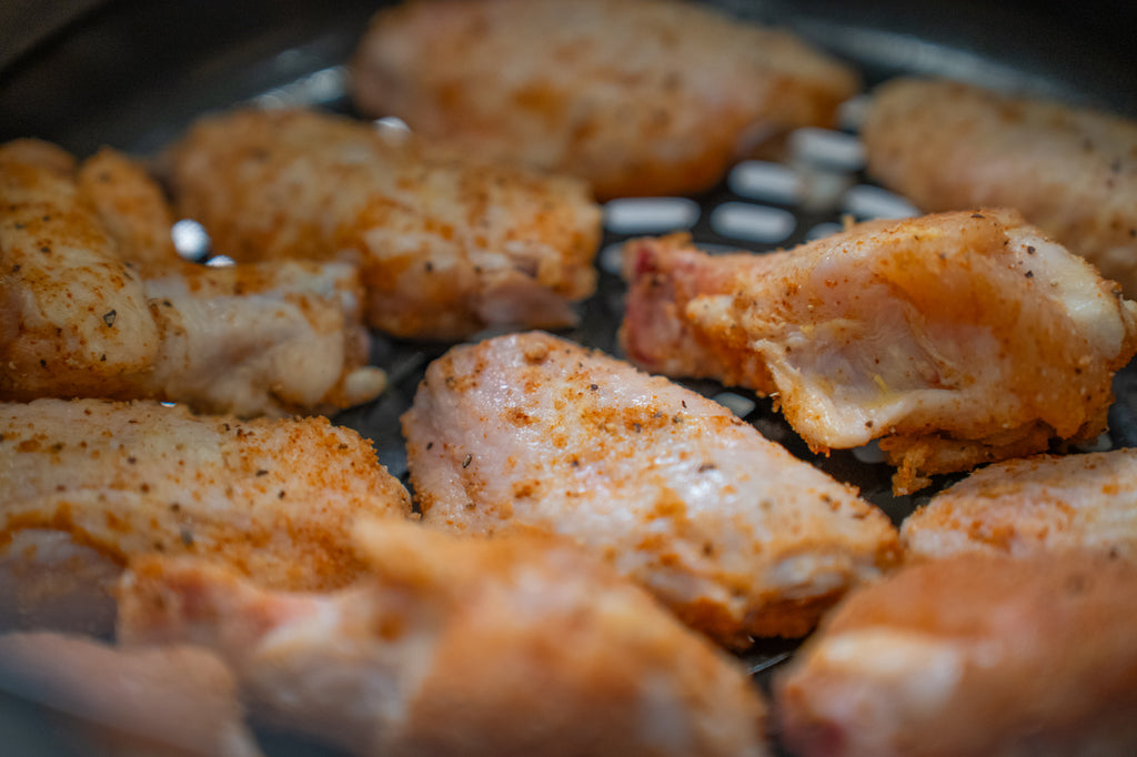 chicken wings in a airfryer basket