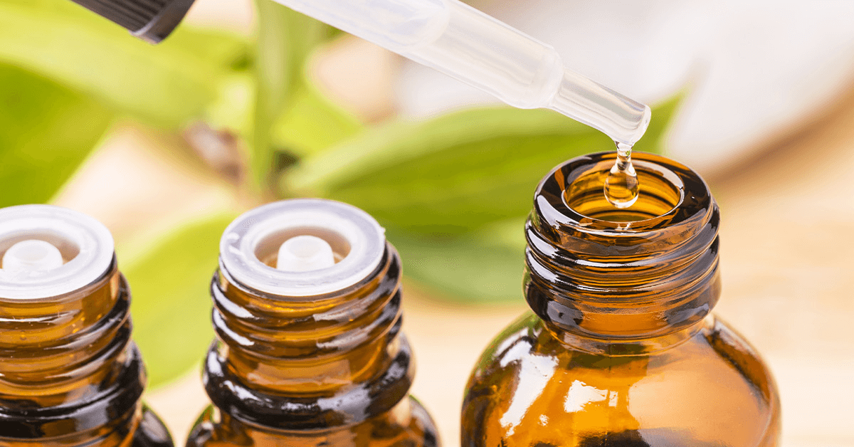 close up of the top of three tincture bottles