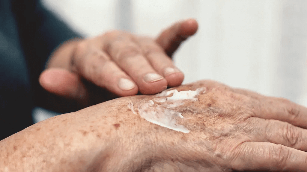 hands rubbing in cbd cream onto the back of their hand