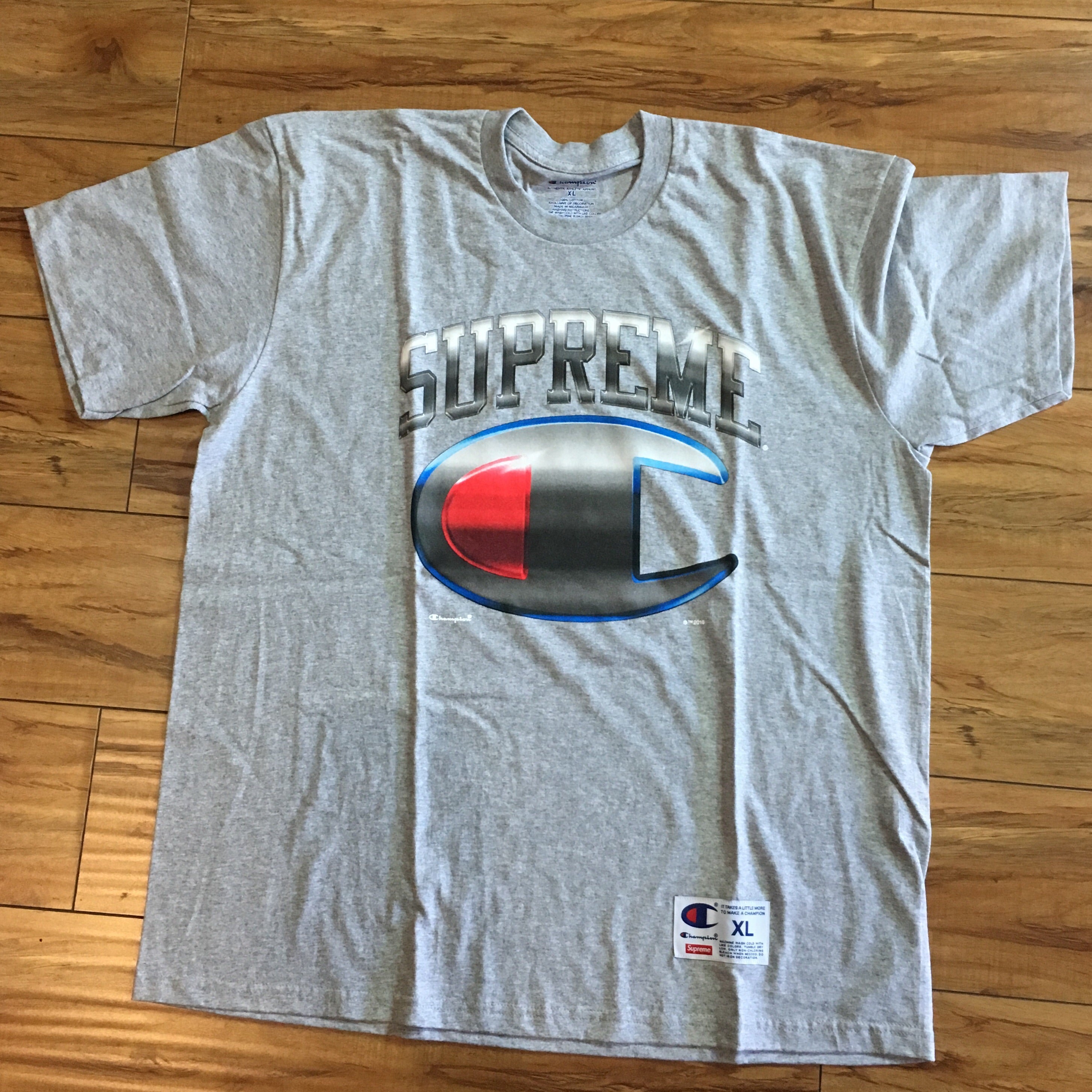 supreme champion tee