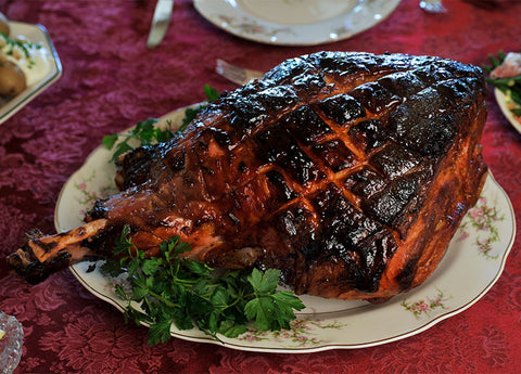 Easter recipes include roast leg of ham on a plate 