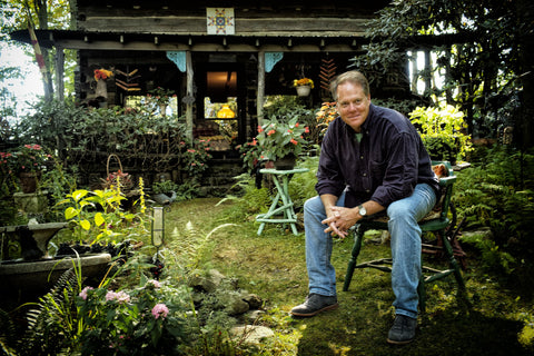 Picture of Jim Millican, creator of Big Delicious Brand, sitting outside his home in Raleigh, NC