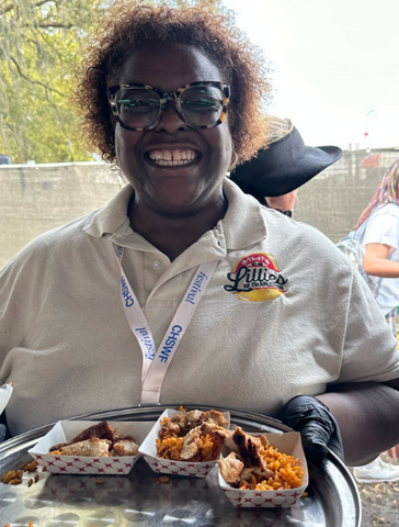 Lillies of Charleston co-owner sampling their new hot sauce