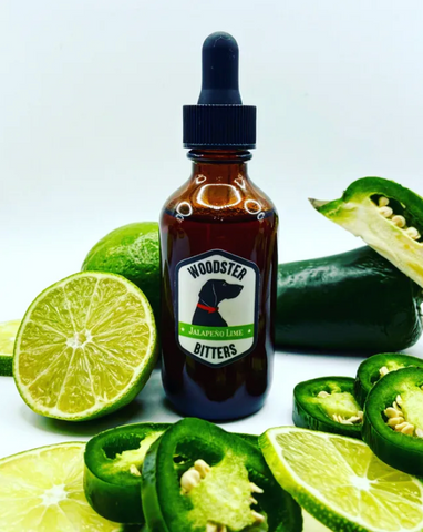 Woodster Jalapeno Lime Bitters with limes and jalapenos