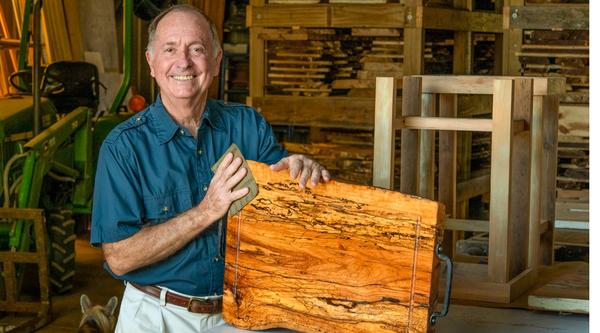 Murray Thompson with one of his handcrafted cutting boards 