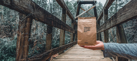 a bag of DaySol coffee beans on a bridge