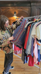 Randi Mikesell checks the racks at The August Connection. 