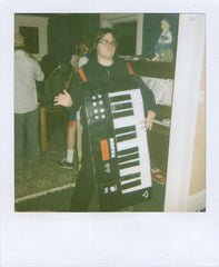 Jes Kramer holding keyboard.