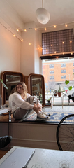 Alana Sawicki sitting on a sill at OTONO. 