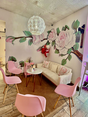 Pink floral seating area at Pochis Sweet Designs. 