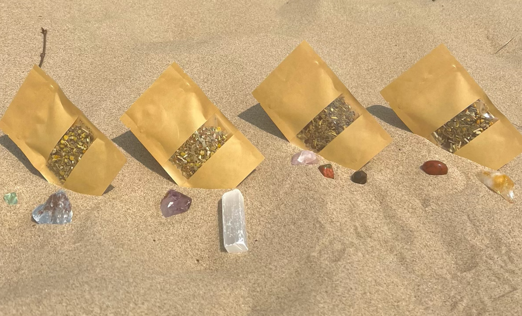Puritea teas with crystals on the beach.