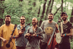 Round Creek String Band poses outdoors.