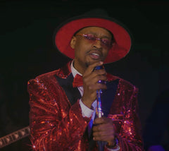Shane Edwards performs in red zoot suit.
