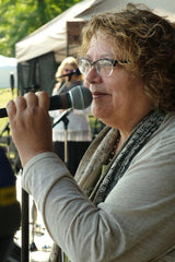 Tiyi Schippers at microphone.