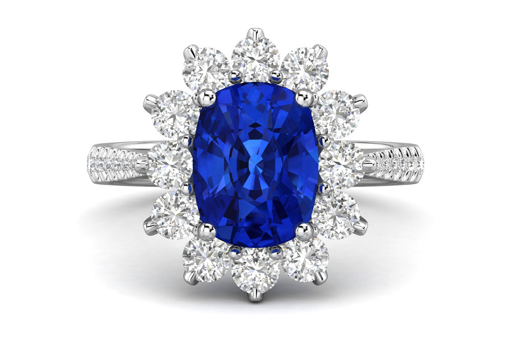 Royal oval blue sapphire engagement ring with diamond entourage