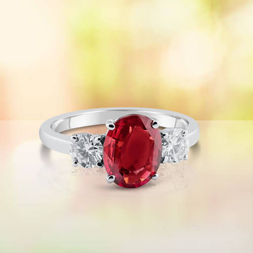 Ruby Engagement Ring with Two Side Stone Round Diamonds