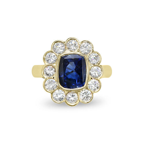 Bague de fiançailles avec saphir bleu et cluster de diamants