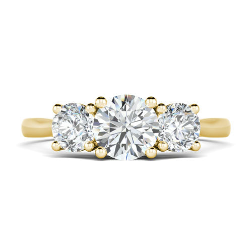 Trilogy engagement ring with round diamonds and tapered band