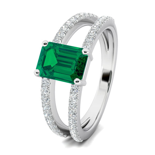 emerald and diamond split shank engagement ring