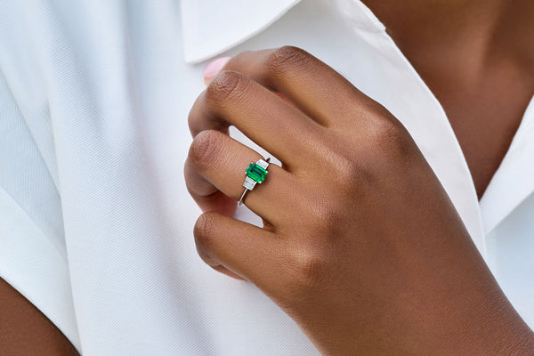 Emerald and diamond baguette side-stones engagement ring