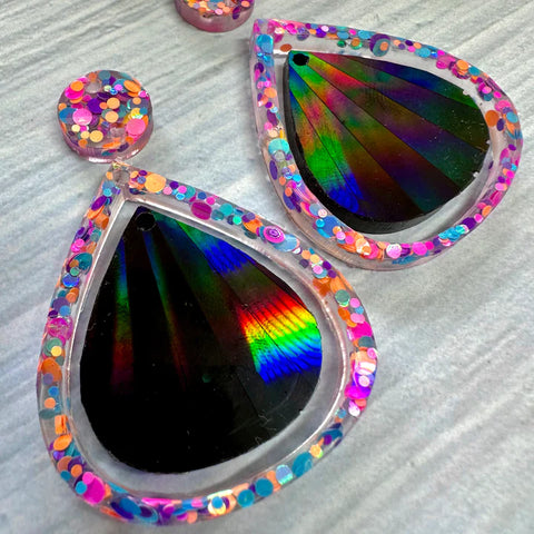 holographic earrings in the shape of a teardrop made of resin