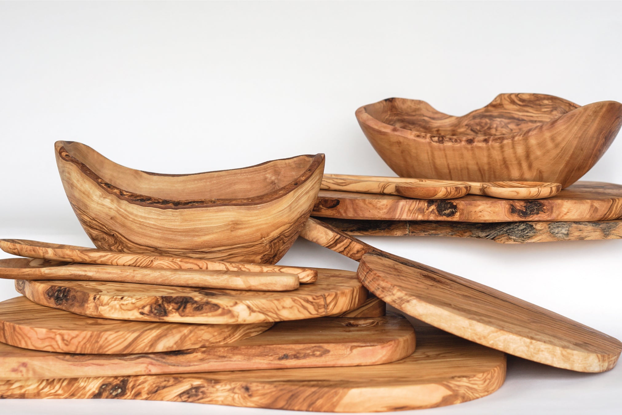 The Tunisia Collection by Fairkind, handcrafted luxury olive wood kitchenware, serving boards and spoons. Handmade by master artisans around the world