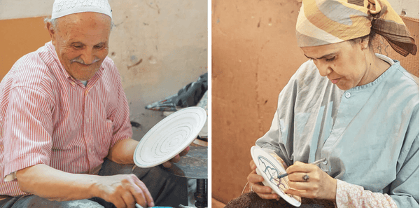 Moroccan artisan painting a ceramic plate by hand.