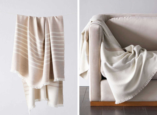 Blush and white neutral striped baby alpaca throw blankets made by artisans. Fairkind limited edition collection