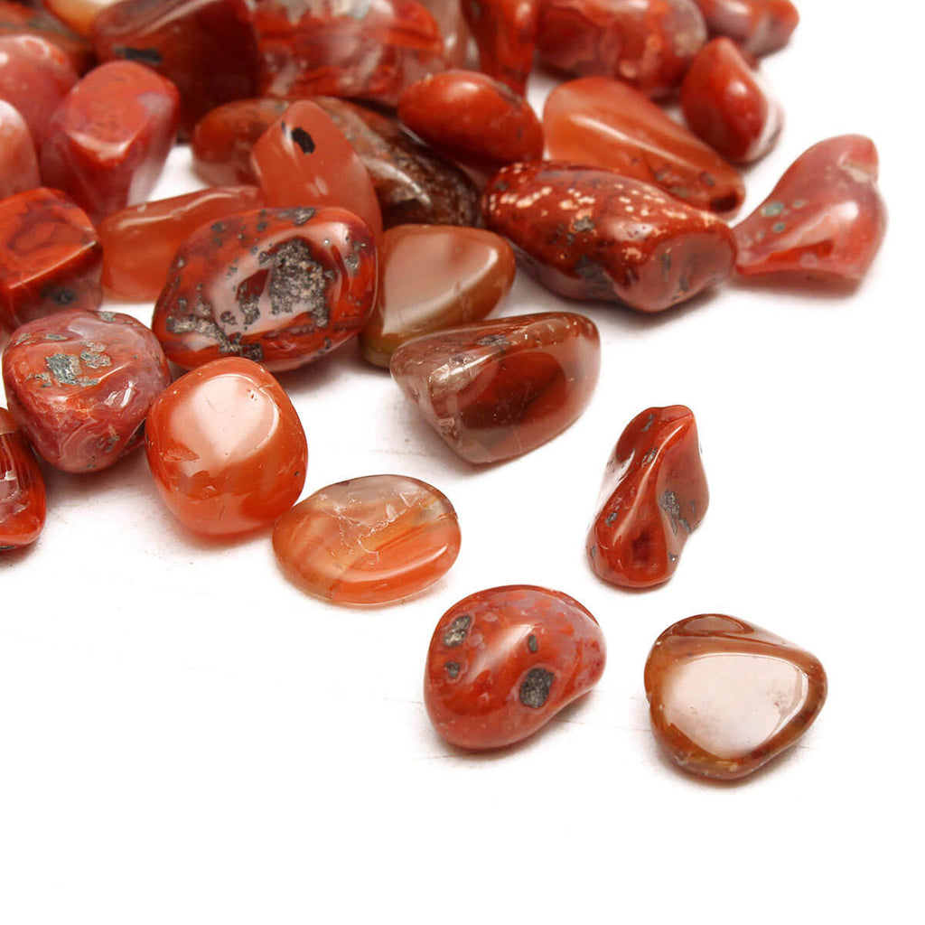 pieces of red smooth stones close up view