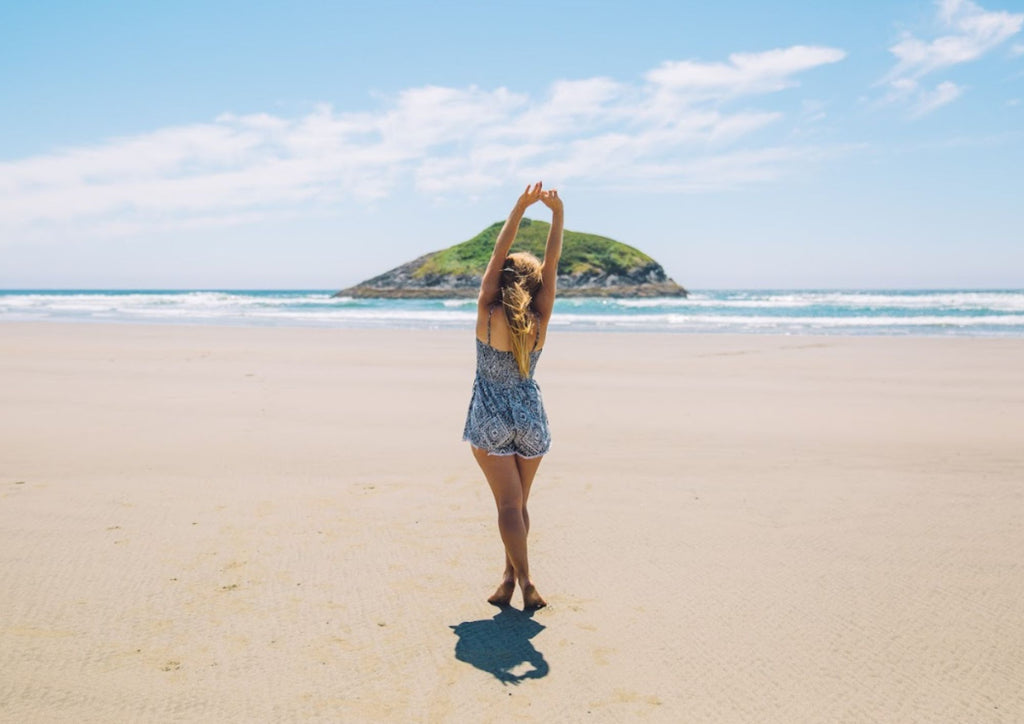 a girl in a white sand beach