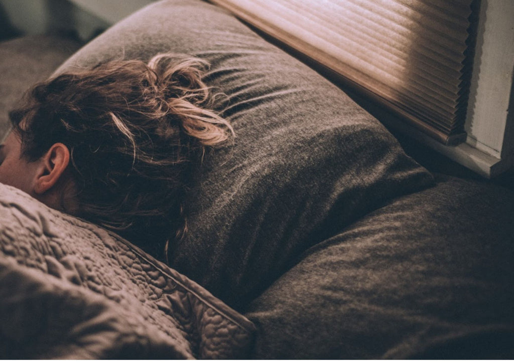 woman lying on bed