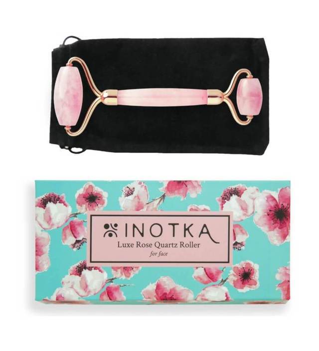 Inotka Luxe Rose Quartz Roller placed on black pouch and box underneath