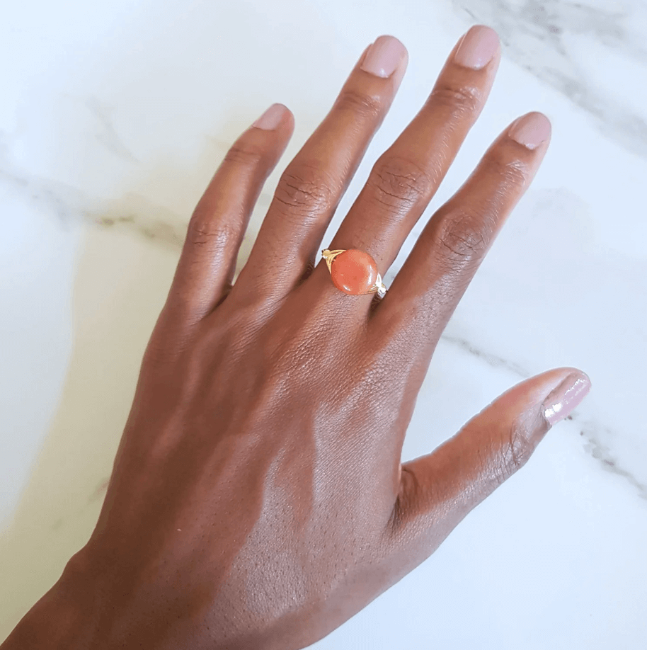 picture of a hand wearing red aventurine ring