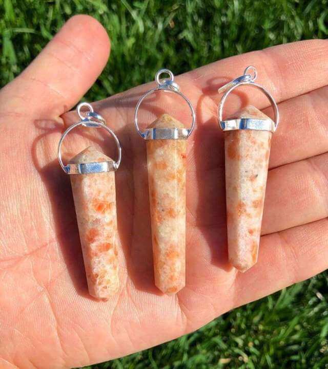 three peached colored crystal pendants silver connector