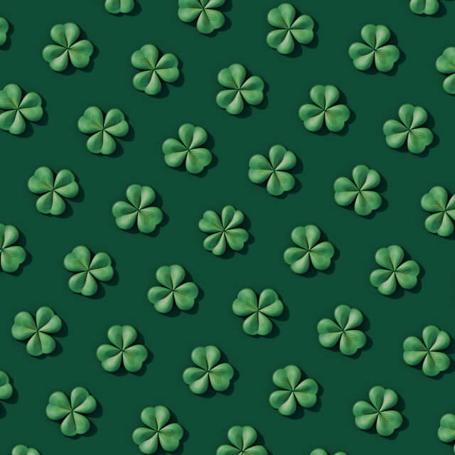 green background with four leaf clover
