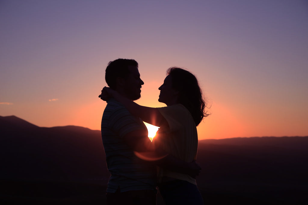 man and woman hugging