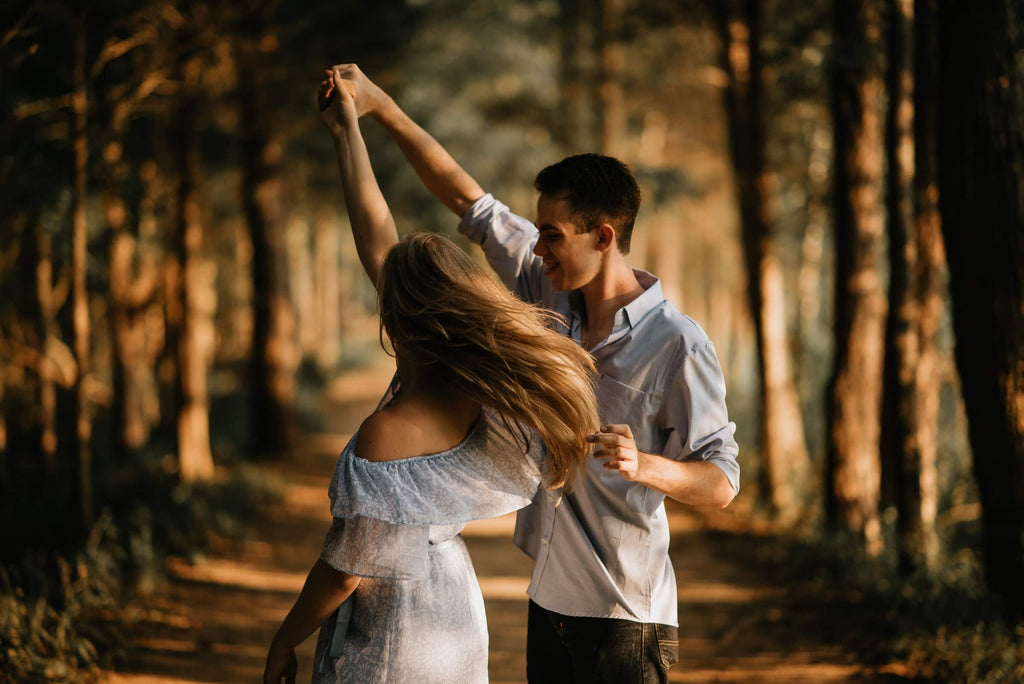 man and woman dancing at the center