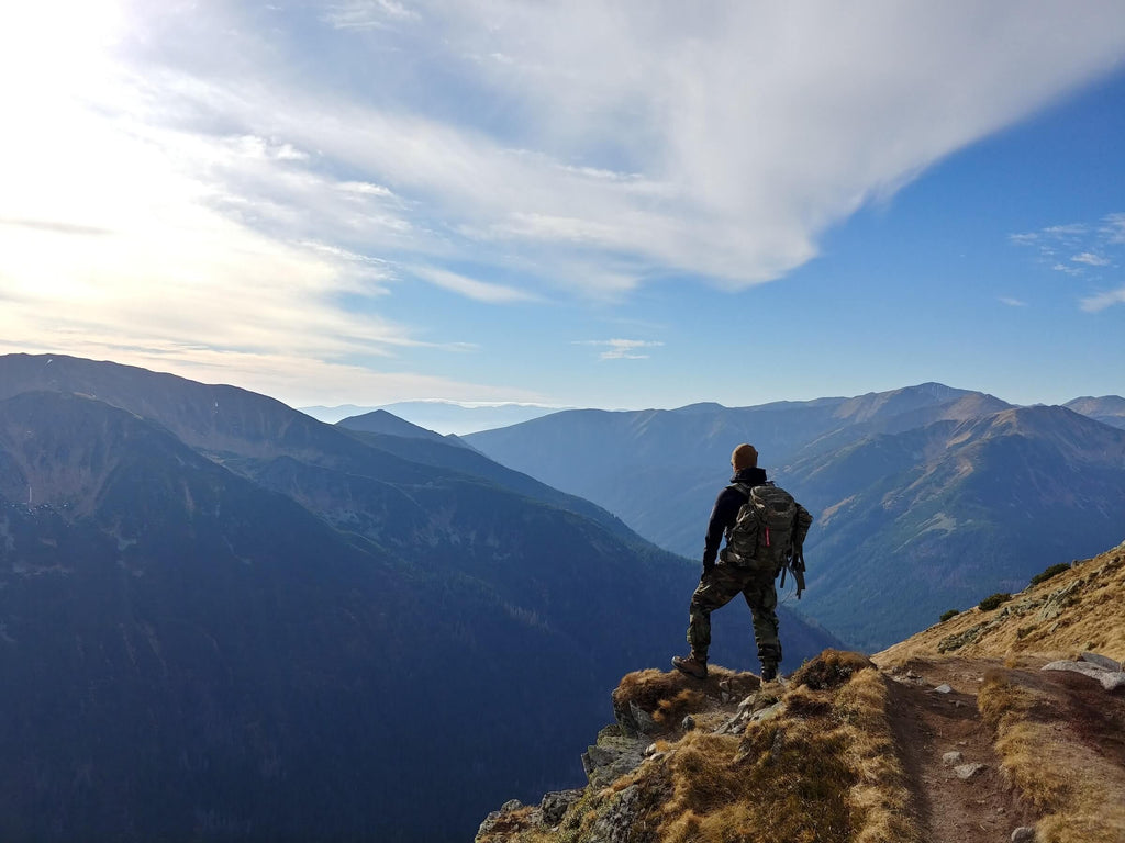 man on top of a mountain