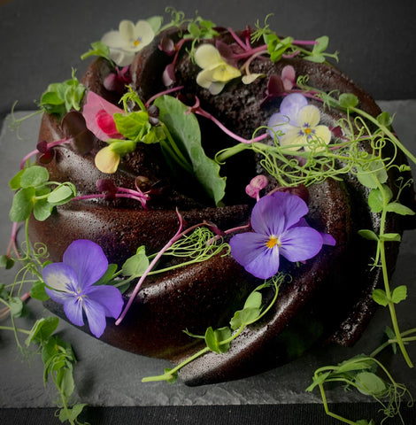 Secret Kiwi Kitchen Chocolate Cake with Flowers and Microgreens