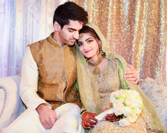 Man and woman in traditional Pakistani wedding clothing