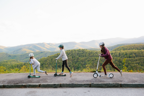 Family riding Micro Scooters