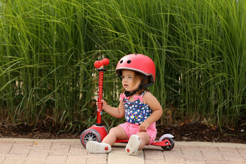 Kid riding Micro Mini Deluxe LED Scooter