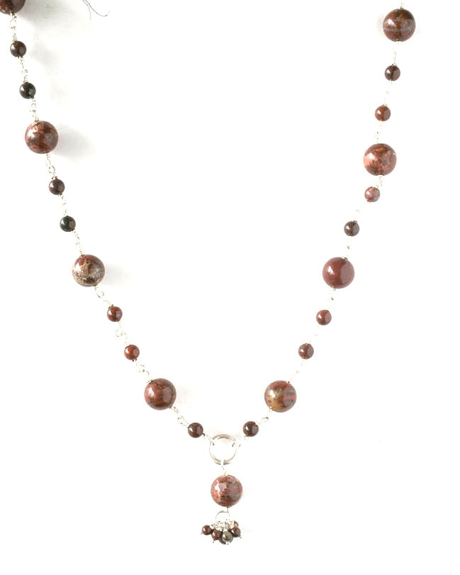 Small and medium size round brown jasper beads connected by sterling silver. It is 60 cms or 26 inches long.