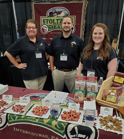 Stoltzfus Meats team showcasing products at a local food show